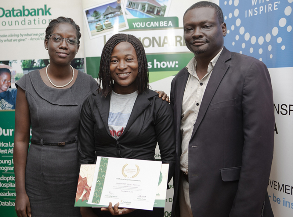 awardee in a photograph with UEW staff