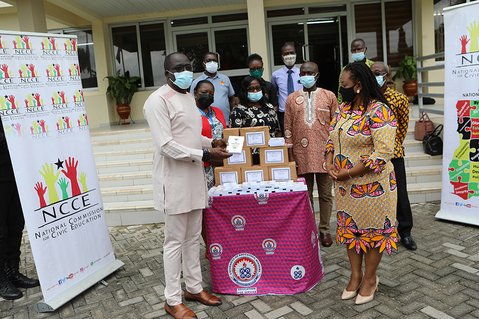 The Pro-Vice-Chancellor (left) presenting the items to National Chairperson of NCCE, Ms. Josephine Nkrumah
