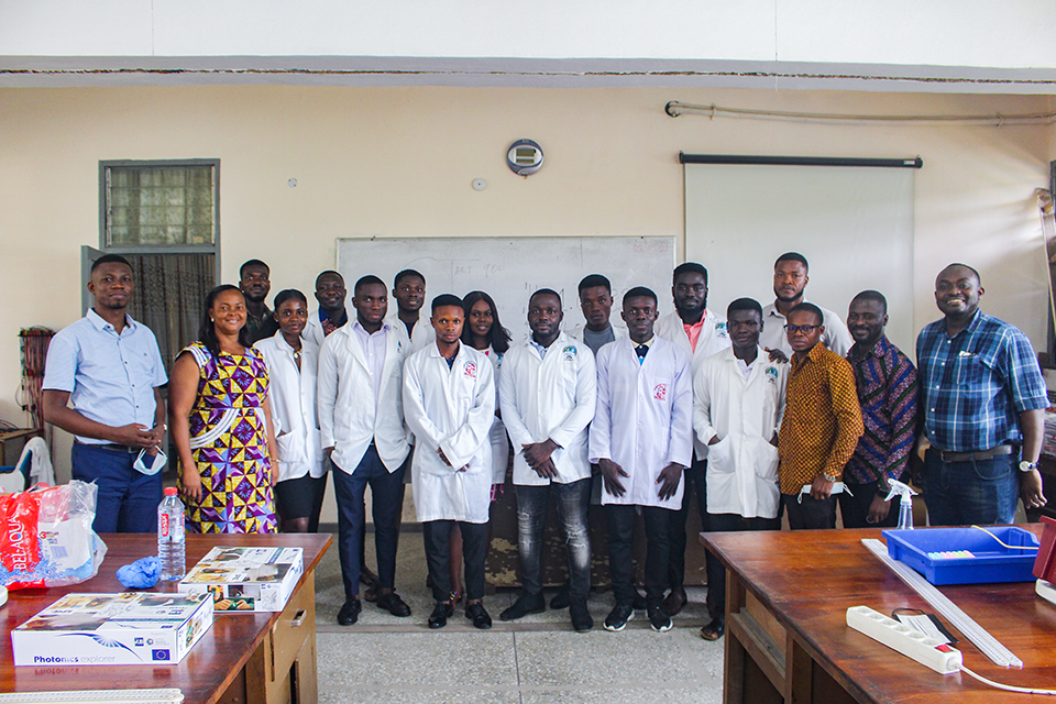 The final year students with their lecturers in a group pose after the exhibition