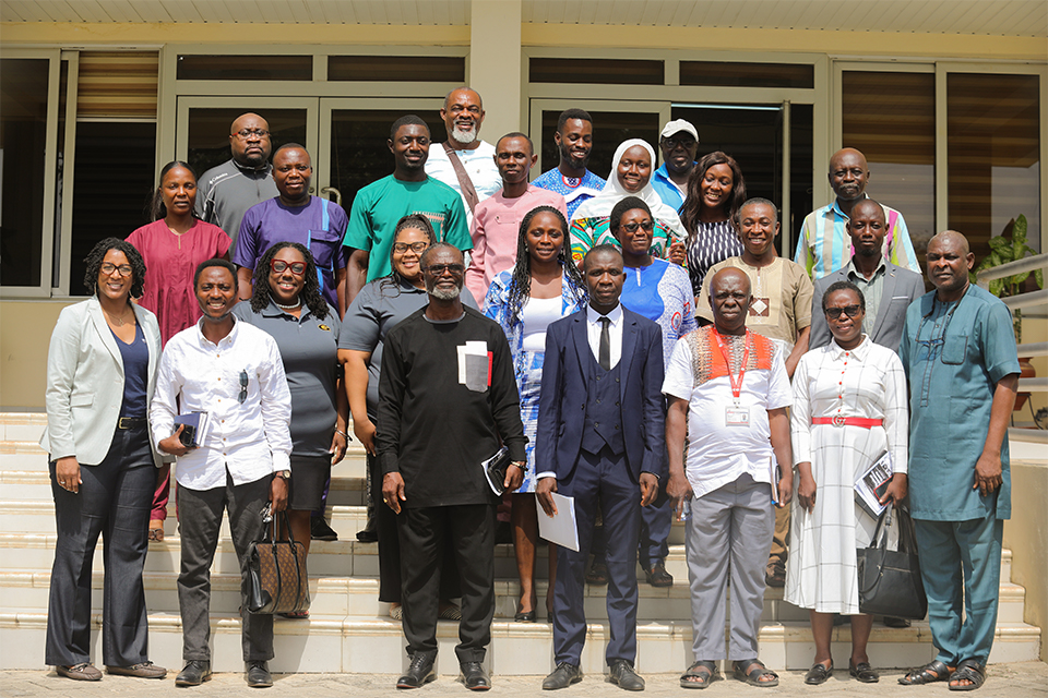 Faculty members of both institutions pose for a group photograph after the conference