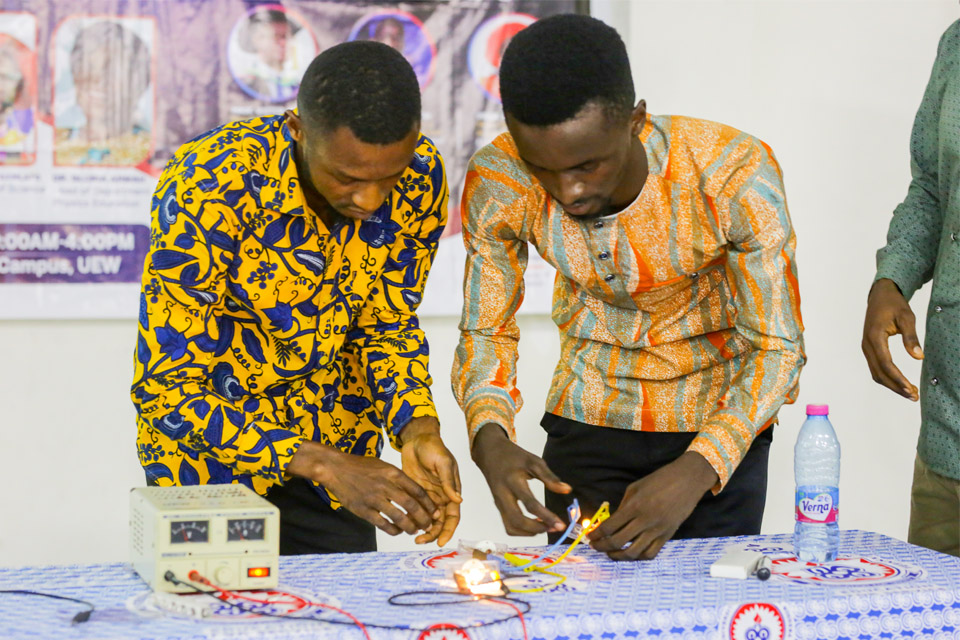 Participants undertaking a practical activity on light energy