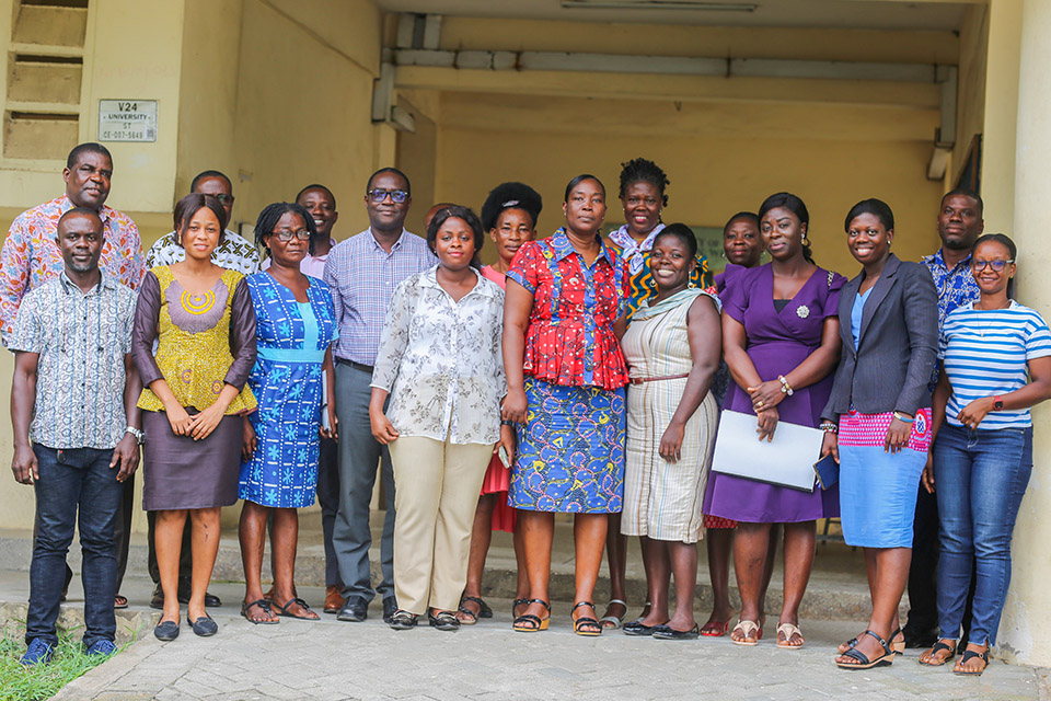 Participants and the resource person in a group photograph after the training