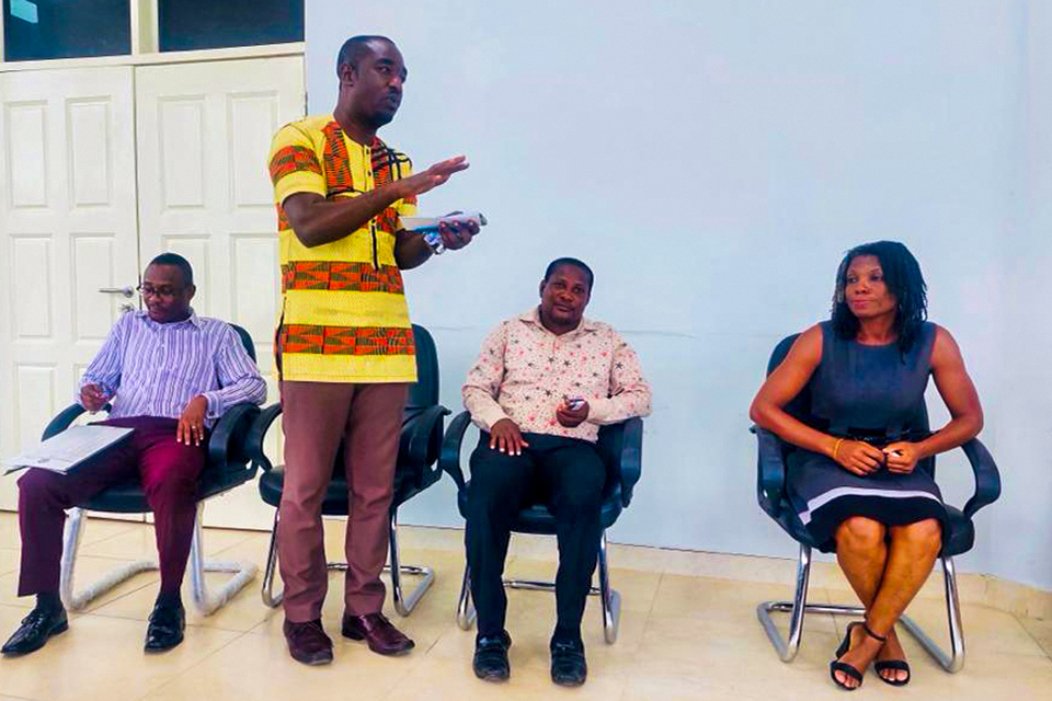 Mr. Isaac Darkoh (standing) answering a question from a participant