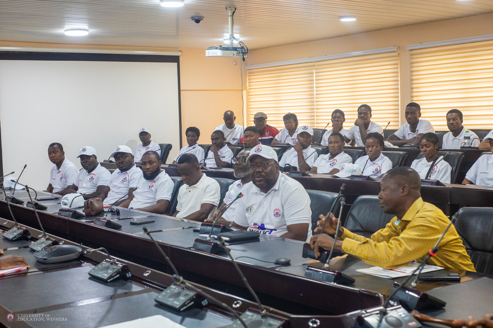 Dr. Theophilus Mensah (2nd from right) reporting Team UEW's performance to Management