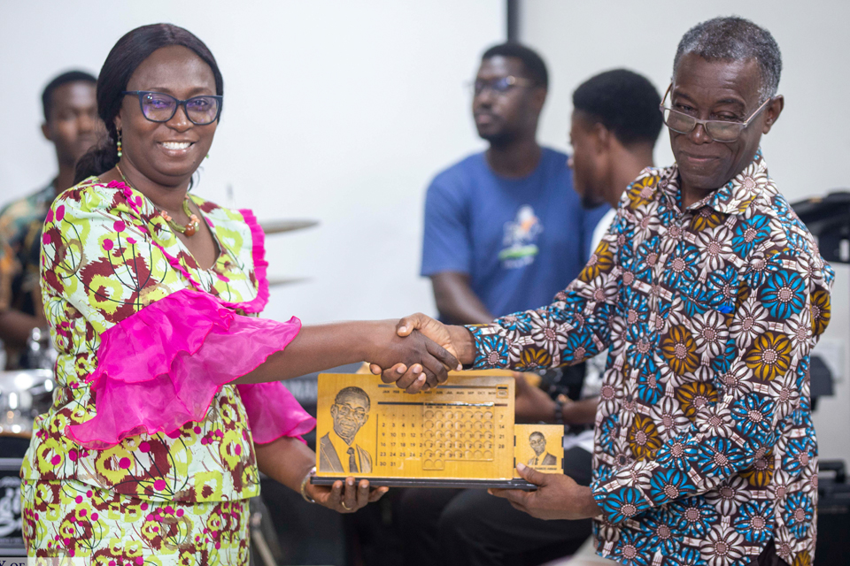 Dr. John Francis Annan (right) receiving his award from Prof. Emma Eshun