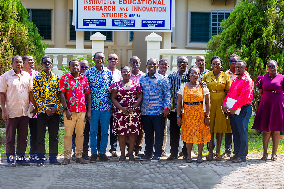 A group photograph taken at the forecourt of IERIS