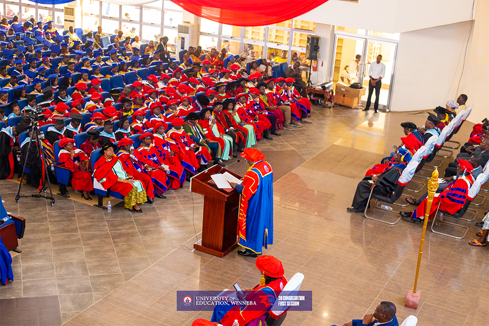 An aerial shot of the Chancellor addressing the congregation 