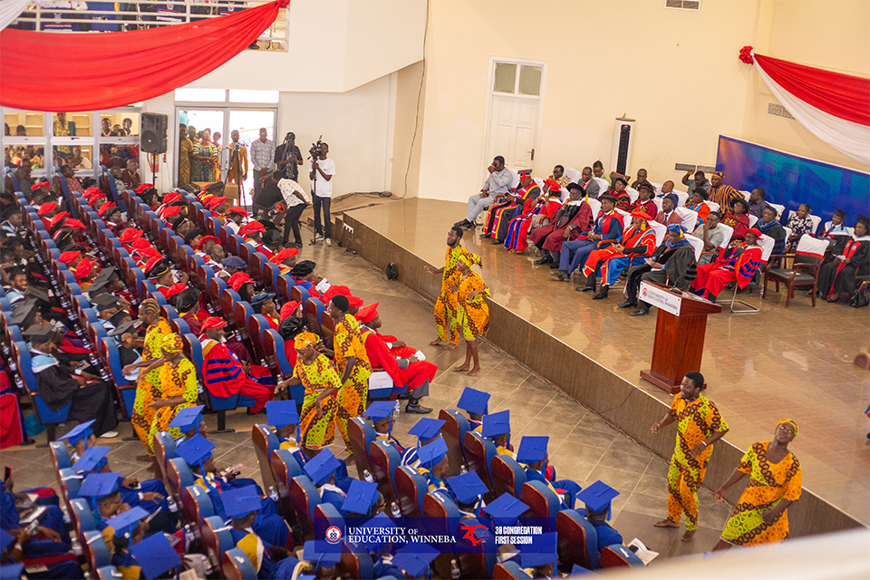 An aerial shot of graduands, academic heads, and faculty members enjoying an indigenous dance performance by students from the School of Creative Arts.