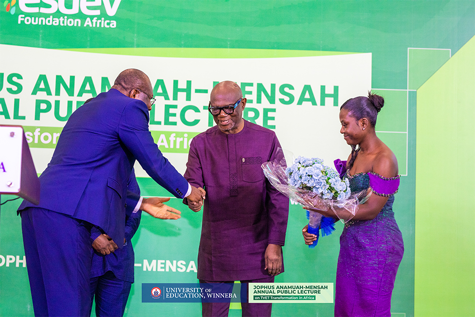 Prof. Jophus Anamuah-Mensah (centre) presenting a gift in his honour