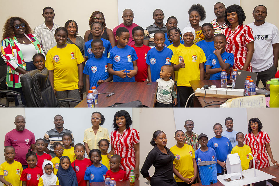 An image showing students and parents gathered for a group photograph following their presentations