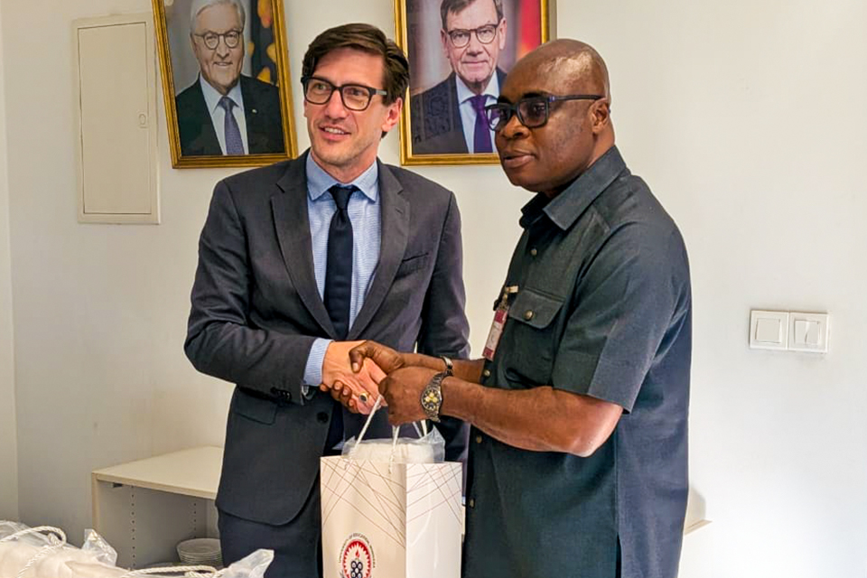 Prof. Stephen Jobson Mitchual (right) presenting UEW souvenirs to H. E. Frederik Landshoft 